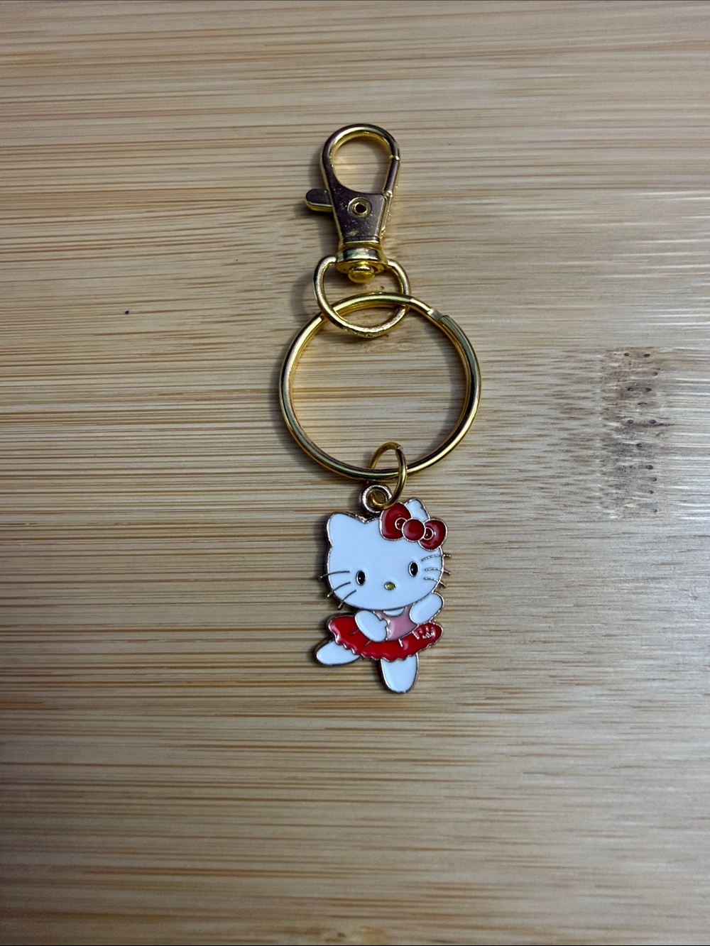 Hello Kitty White and Red Enamel Gold Keychain Charm